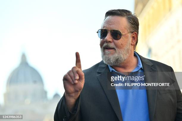 New Zealand actor and director Russell Crowe gestures as he arrives for a masterclass on October 15, 2022 at the Auditorium Via dela Conciliazione in...