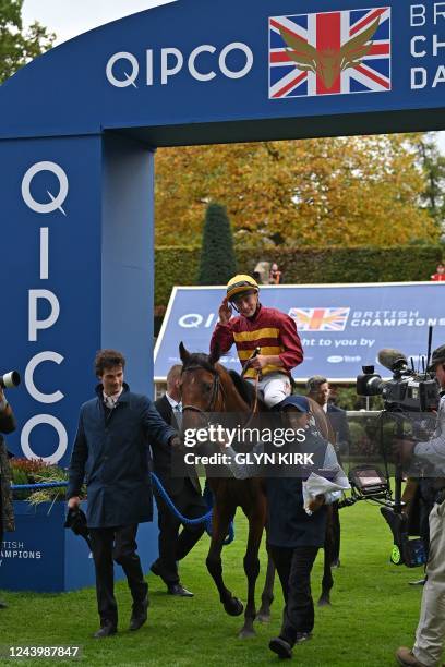 British jockey Tom Marquand returns to the winner's enclosure on Bayside Boy after victory in the Queen Elizabeth II Stakes on Qipco British...