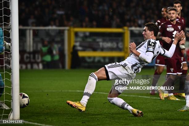 Juventus' Serbian forward Dusan Vlahovic scores the opening goal during the Italian Serie A football match between Torino and Juventus on October 15,...
