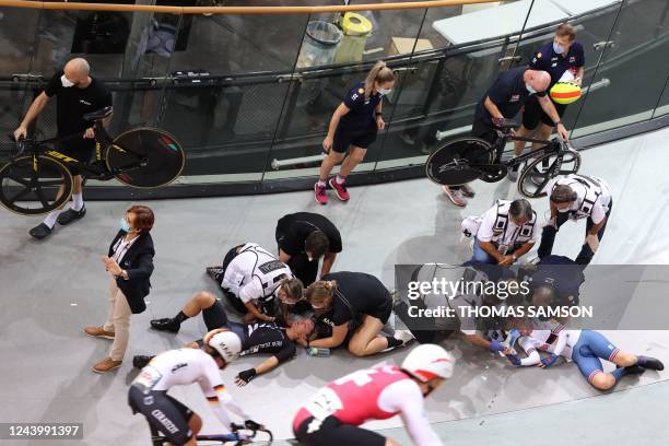 Great Britain's Laura Kenny and New Zealand's Michaela Drummond crash during the Women's Madison 30km final during the UCI Track Cycling World...