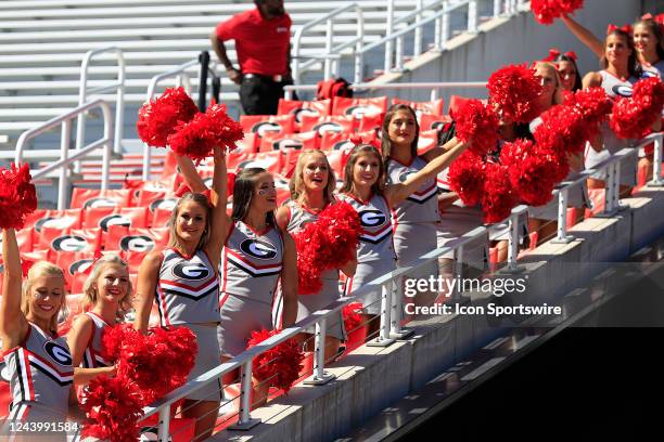 Cheerleaders greet the football team prior to the college football game between the Georgia Bulldogs and the Vanderbilt Commodores on October 15,...