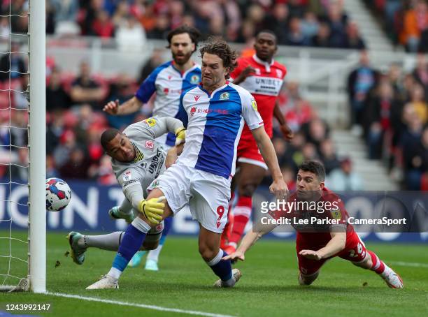 Blackburn Rovers' Sam Gallagher strikes the ball towards goal despite the attentions of Middlesbrough's Zack Steffen but it goes in off...
