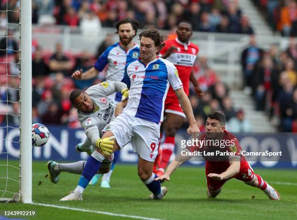Blackburn Rovers' Sam Gallagher strikes the ball towards goal despite the attentions of Middlesbrough's Zack Steffen but it goes in off...