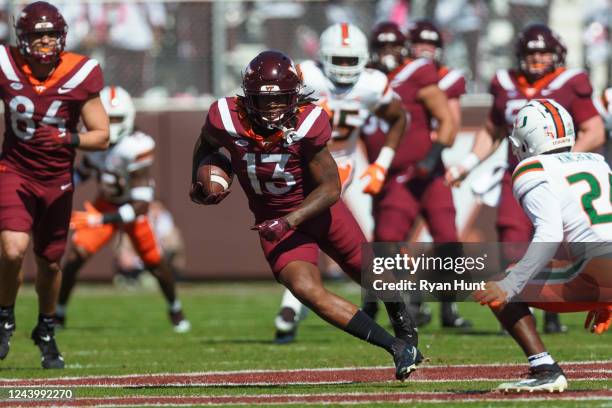 Tight end Dae'Quan Wright of the Virginia Tech Hokies runs the ball against the Miami Hurricanes at Lane Stadium on October 15, 2022 in Blacksburg,...