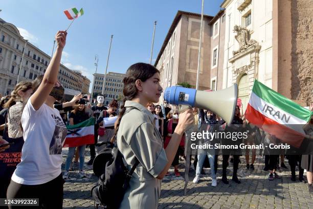 Demonstrator speaks with a megaphone during a demonstration organized by Iranian students at Piazza Della Repubblica against the Iranian Government...