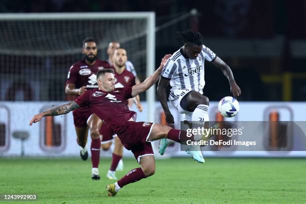 Karol Linetty of Torino FC and Weston Mckennie of Juventus FC battle for the ball during the Serie A match between Torino FC and Juventus at Stadio...