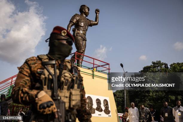 Military stands by Thomas Sankara's statue during the ceremony for the 35th anniversary of Thomas Sankaras assassination, in Ouagadougou, on October...