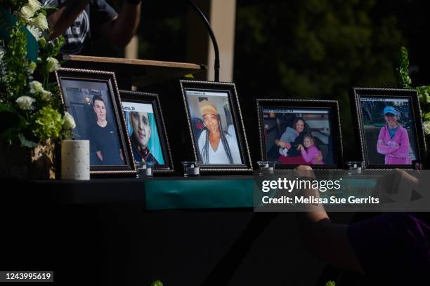 People set up a memorial table with images of the victims of a shooting in the Hedignham neighborhood on October 15, 2022 in Raleigh, North Carolina....