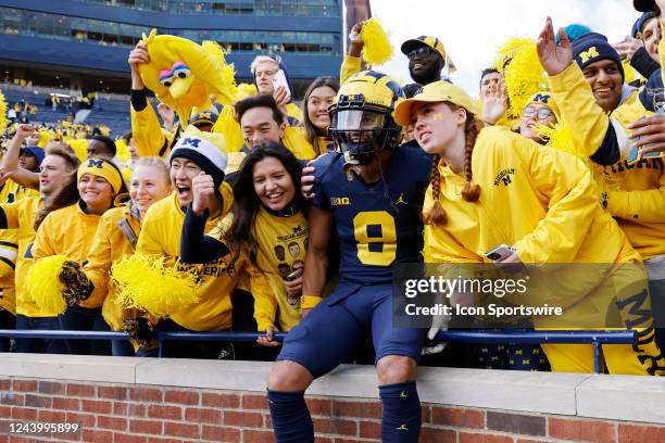 Michigan Wolverines wide receiver Ronnie Bell celebrates with fans following a win in a college football game against the Penn State Nittany Lions on...