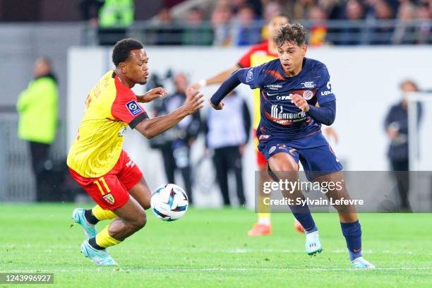 Lois Openda of RC Lens competes for the ball with Khalil Fayad of Montpellier during the Ligue 1 Uber Eats match between Lens and Montpellier at...