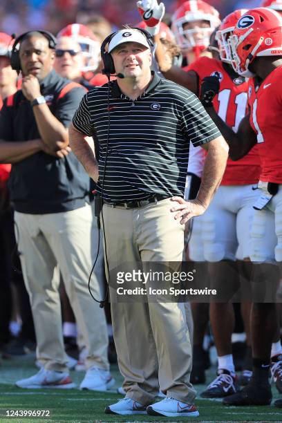 Georgia Bulldogs head coach Kirby Smart looks at a reply on the end zone video board during the college football game between the Georgia Bulldogs...