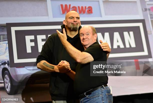 Democratic candidate for U.S. Senate John Fetterman embraces U.S. Senator Chris Coons during a rally at Nether Providence Elementary School on...
