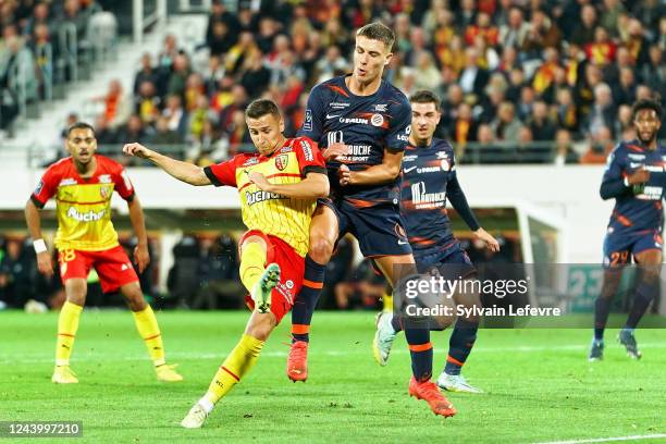 Przemyslaw Adam Frankowski of RC Lens is challenged by Maxime Esteve of Montpellier during the Ligue 1 Uber Eats match between Lens and Montpellier...