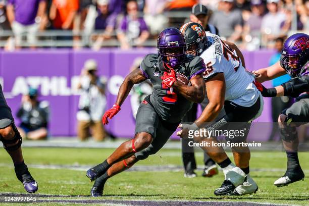 Horned Frogs running back Emari Demercado runs through the line of scrimmage during the game between the TCU Horned Frogs and the Oklahoma State...