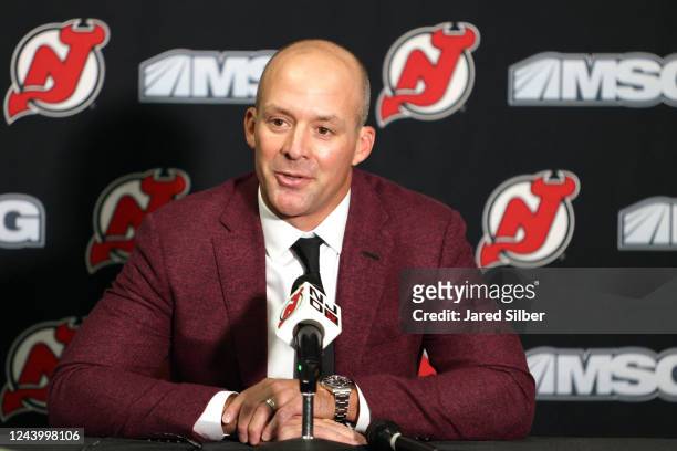 Recently retired defenseman Andy Greene of the New Jersey Devils speaks to the media prior to the game against the Detroit Red Wings at the...