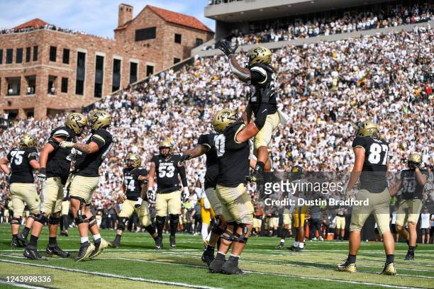 Running back Anthony Hankerson of the Colorado Buffaloes celebrates with teammates after a third period touchdown against the California Golden Bears...