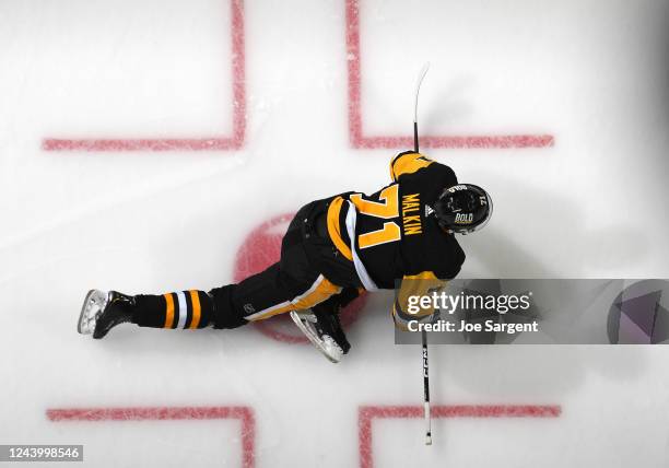 Evgeni Malkin of the Pittsburgh Penguins stretches before the game against the Tampa Bay Lightning at PPG PAINTS Arena on October 15, 2022 in...