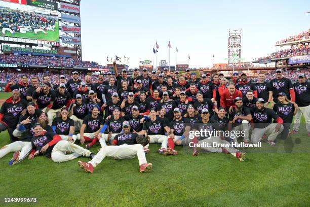 Members of the Philadelphia Phillies pose for a photo to celebrate their win over the Atlanta Braves at Citizens Bank Park on Saturday, October 15,...