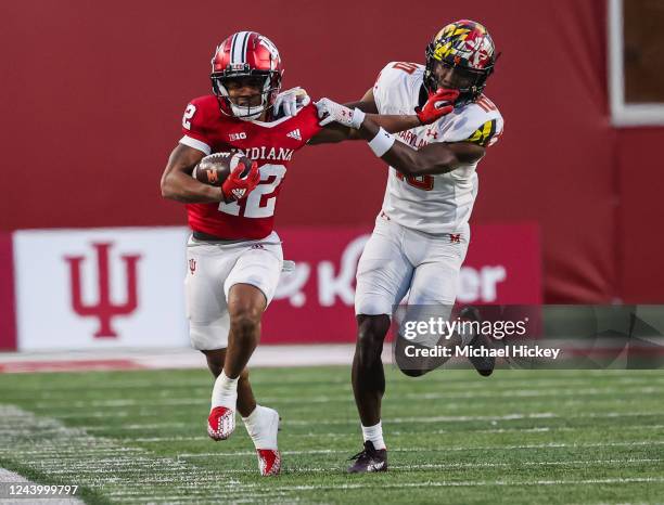 Jaylin Lucas of the Indiana Hoosiers runs the ball as Tyler Baylor of the Maryland Terrapins tries for the tackle during the second half at Memorial...