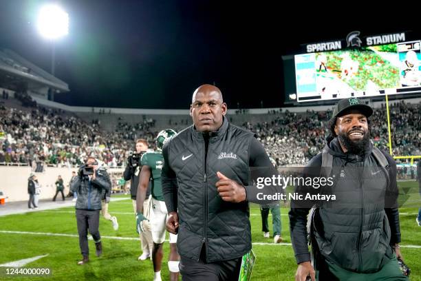 Head coach Mel Tucker of the Michigan State Spartans runs off the field after defeating the Wisconsin Badgers in double overtime at Spartan Stadium...