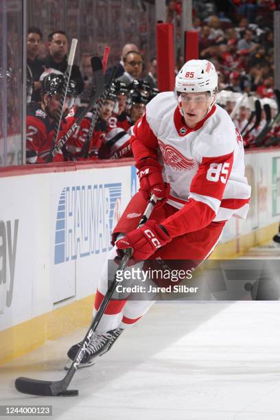 Elmer Soderblom of the Detroit Red Wings skates with the puck against the New Jersey Devils at the Prudential Center on October 15, 2022 in Newark,...
