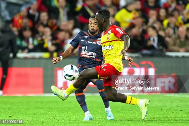 Teji Savanier of Montpellier competes for the ball with Deiver Machado of RC Lens during the Ligue 1 Uber Eats match between Lens and Montpellier at...