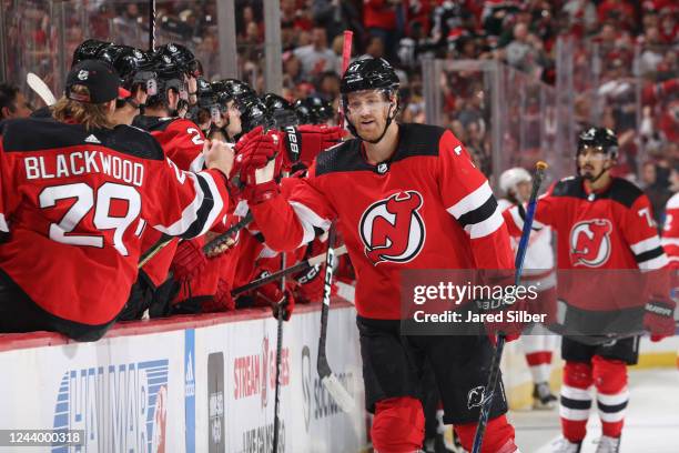 Dougie Hamilton of the New Jersey Devils celebrates with teammates after scoring a goal in the first period against the Detroit Red Wings at the...