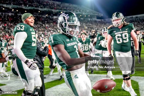 Jayden Reed of the Michigan State Spartans reacts after making the game-winning reception against the Wisconsin Badgers in double overtime at Spartan...