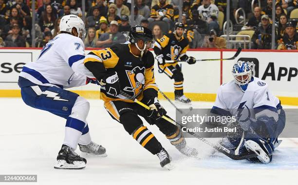 Brian Elliott of the Tampa Bay Lightning makes a save on a shot by Pierre-Olivier Joseph of the Pittsburgh Penguins in the first period during the...