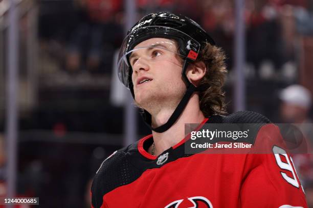 Dawson Mercer of the New Jersey Devils looks on against the Detroit Red Wings at the Prudential Center during the home opener on October 15, 2022 in...