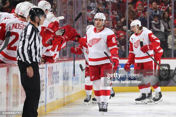 Ben Chiarot of the Detroit Red Wings celebrates with teammates after scoring a goal in the second period against the New Jersey Devils at the...