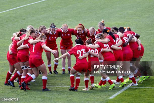 Canada players huddle before the New Zealand 2021 Women's Rugby World Cup Pool A match between Canada and Italy at Waitakere Stadium in Auckland on...
