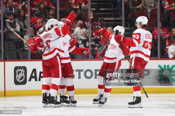 Ben Chiarot of the Detroit Red Wings celebrates with teammates after scoring a goal in the second period against the New Jersey Devils at the...