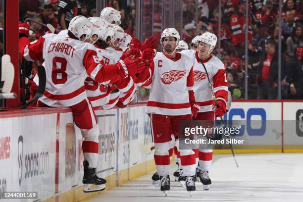 Dylan Larkin of the Detroit Red Wings celebrates with teammates after scoring a goal in the second period against the New Jersey Devils at the...