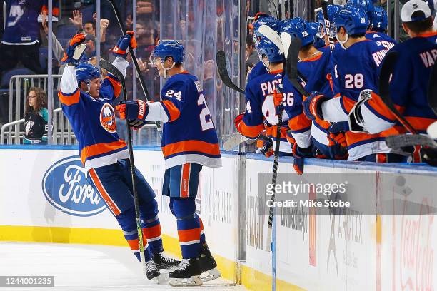 Scott Mayfield of the New York Islanders is congratulated by Robin Salo after scoring a goal against the Anaheim Ducks during the second period at...