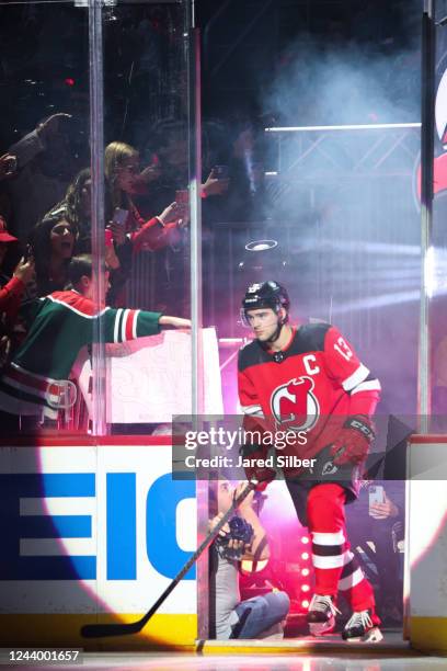 Nico Hischier of the New Jersey Devils takes the ice during player introductions against the Detroit Red Wings at the Prudential Center during the...