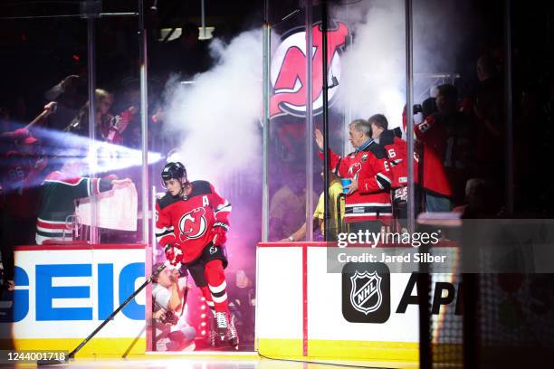 Jack Hughes of the New Jersey Devils takes the ice during player introductions against the Detroit Red Wings at the Prudential Center during the home...