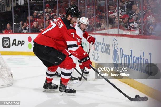 Dougie Hamilton of the New Jersey Devils skates with the puck against the Detroit Red Wings at the Prudential Center during the home opener on...