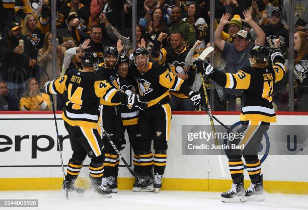 Jeff Carter of the Pittsburgh Penguins celebrates teammates after scoring a goal in the third period during the game against the Tampa Bay Lightning...