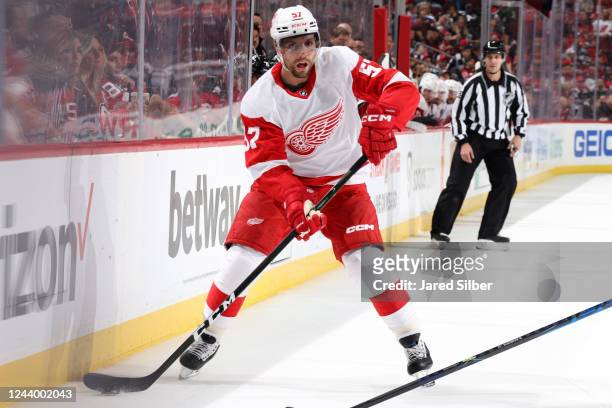David Perron of the Detroit Red Wings skates with the puck against the New Jersey Devils at the Prudential Center on October 15, 2022 in Newark, New...