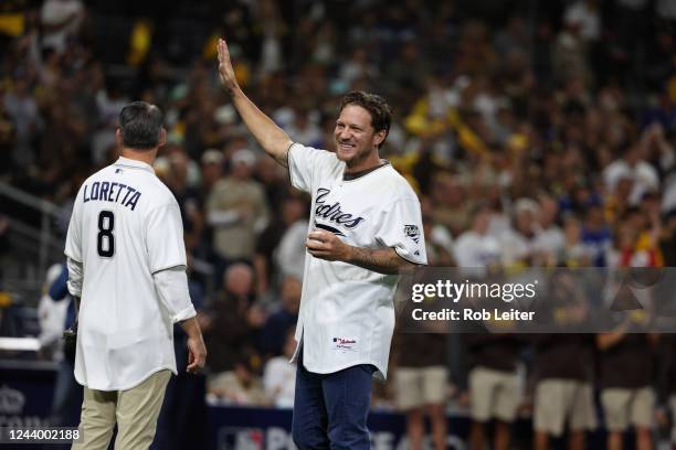 Jake Peavy waves before throwing the ceremonial first pitch before the game between the Los Angeles Dodgers and the San Diego Padres at Petco Park on...
