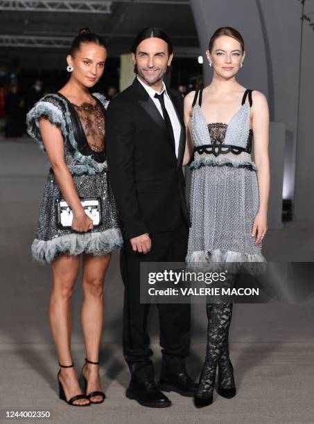 Swedish actress Alicia Vikander, Louis Vuitton creative director Nicolas Ghesquiere and US actress Emma Stone arrive for the 2nd Annual Academy...