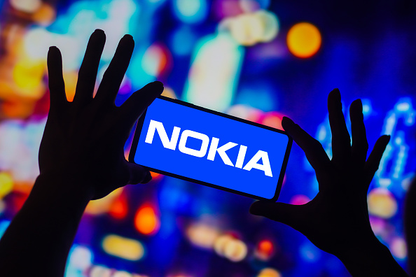 In this photo illustration, the Nokia Corporation logo is...
