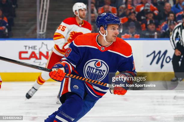 Edmonton Oilers Left Wing Zach Hyman makes a pass and chases the puck up ice in the first period during the Edmonton Oilers game versus the Calgary...