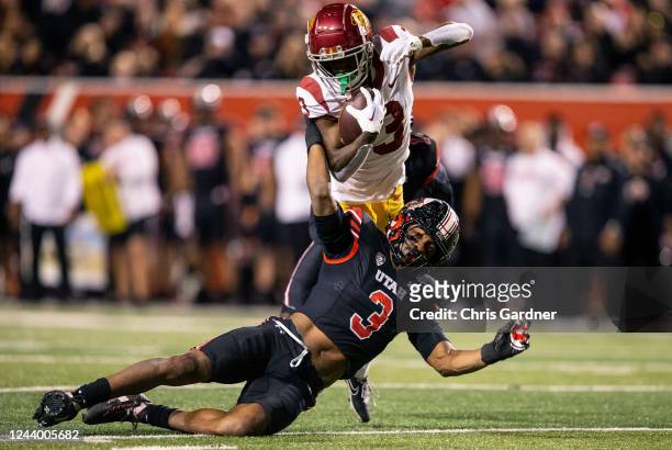 Mohamoud Diabate of the Utah Utes brings down Jordan Addison of the USC Trojans with one hand during the second half of their game October 15, 2022...