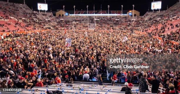 Fans rush the field after the Utah Utes upset the USC Trojans October 15, 2022 Rice-Eccles Stadium in Salt Lake City Utah.