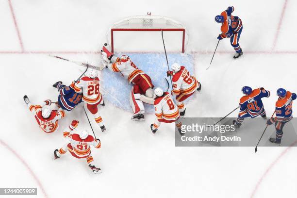 Daniel Vladar of the Calgary Flames makes a save in the final seconds of the game against the Edmonton Oilers on October 15, 2022 at Rogers Place in...