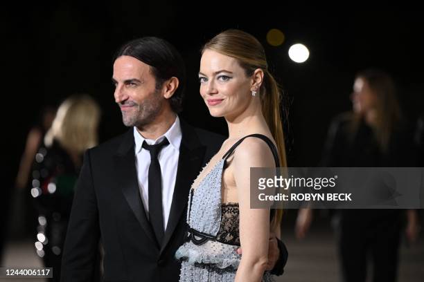 Louis Vuitton creative director Nicolas Ghesquiere and US actress Emma Stone arrive for the 2nd Annual Academy Museum Gala at the Academy Museum of...