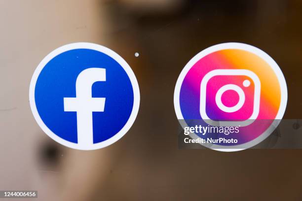 Facebook and Instagram logos are seen on a shop window in Brussels, Belgium on October 12, 2022.