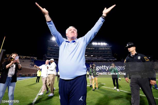 Head coach Mack Brown of the North Carolina Tar Heels celebrates their 38-35 victory against the Duke Blue Devils at Wallace Wade Stadium on October...